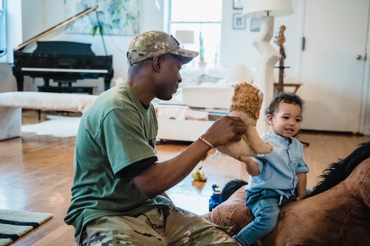 Military Uniform Playing with His Son at Home | Veteran Car Donations

