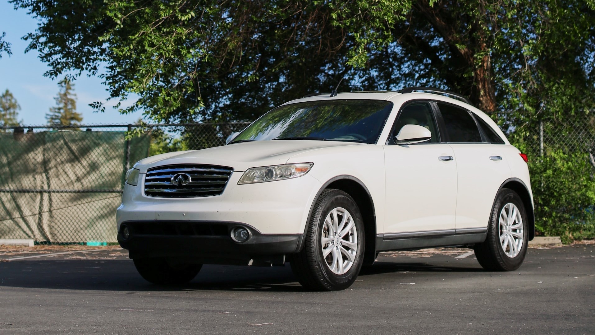 White Car Parked Near the Tree | Veteran Car Donations