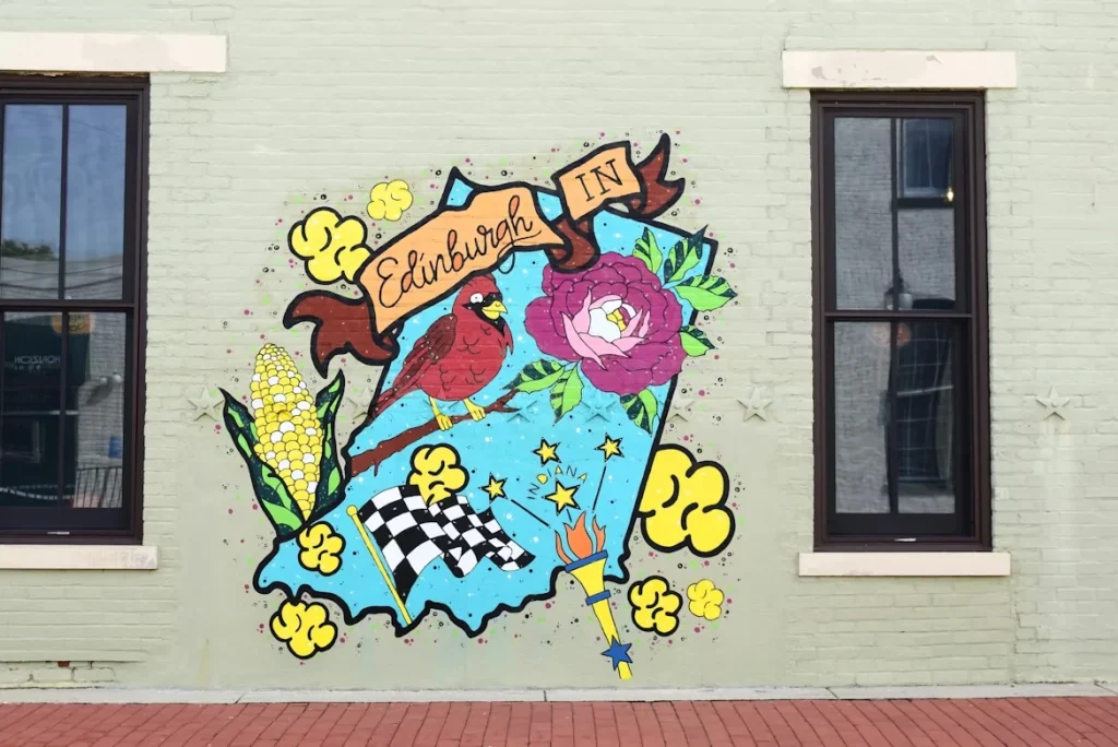 A painted mural of Edinburgh on the side of a building