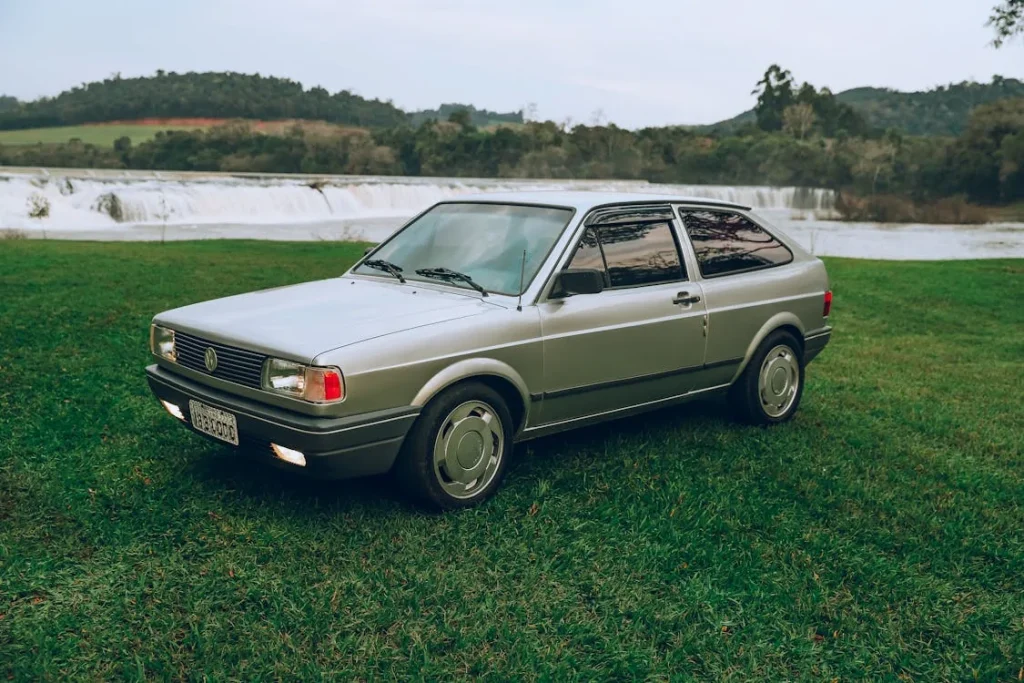 Classic car by scenic waterfall in Brazil