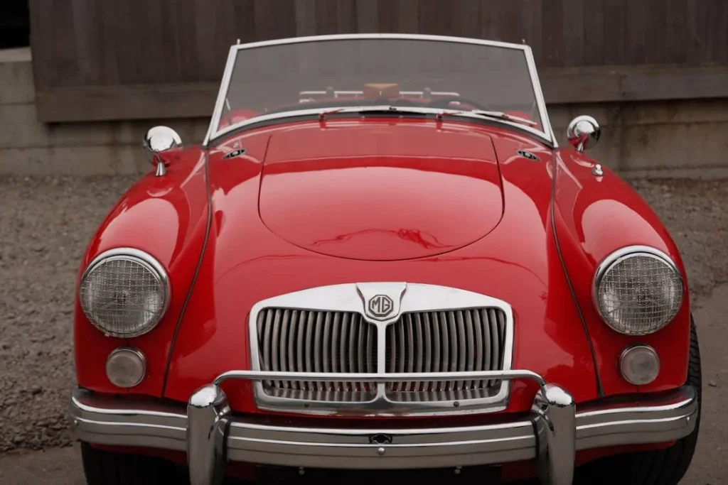 Front view of a classic red MG vintage convertible