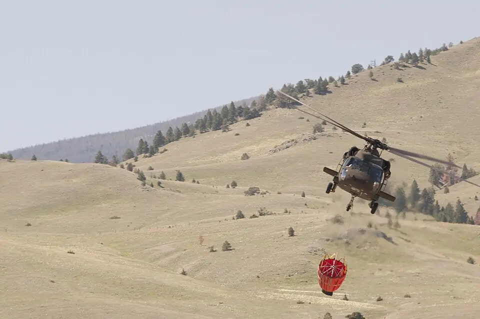 UH-60 Black Hawk helicopter with a firefighting “Bambi” bucket during training at Fort Harrison, Montana