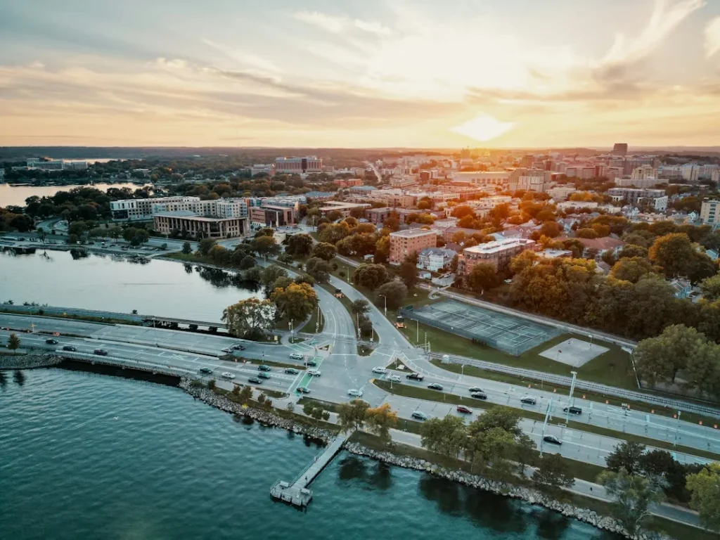 A city skyline next to a body of water in Madison, Wisconsin