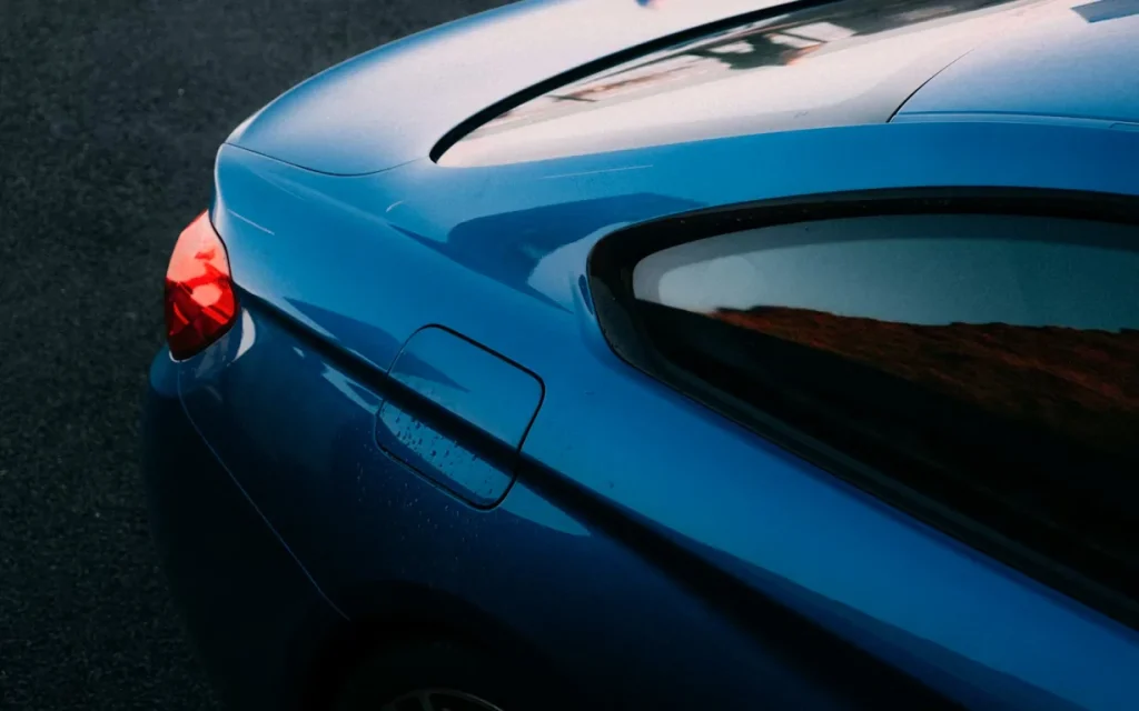 Close-up of the tail light of a blue car