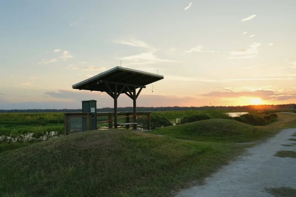 A gazebo sitting on top of a lush green field in Gainesville, Florida