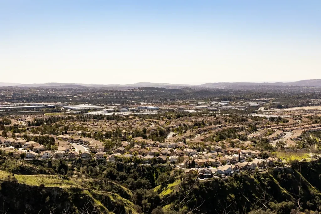 A scenic view of a city surrounded by mountains in Lake Forest, California