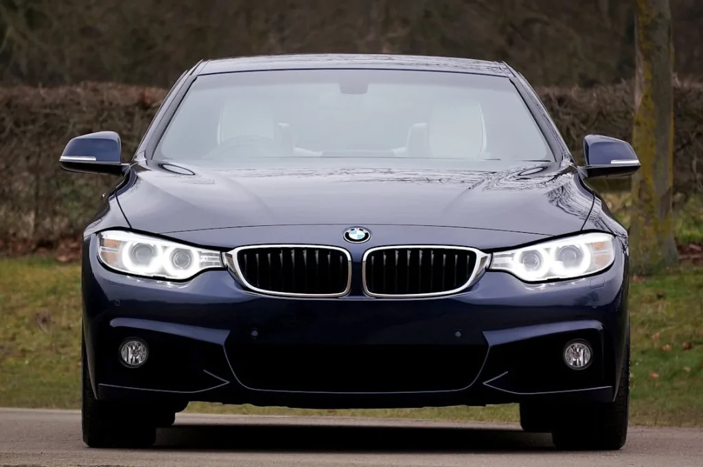 Blue BMW 4 Series coupe parked outdoors showcasing sleek design and modern styling