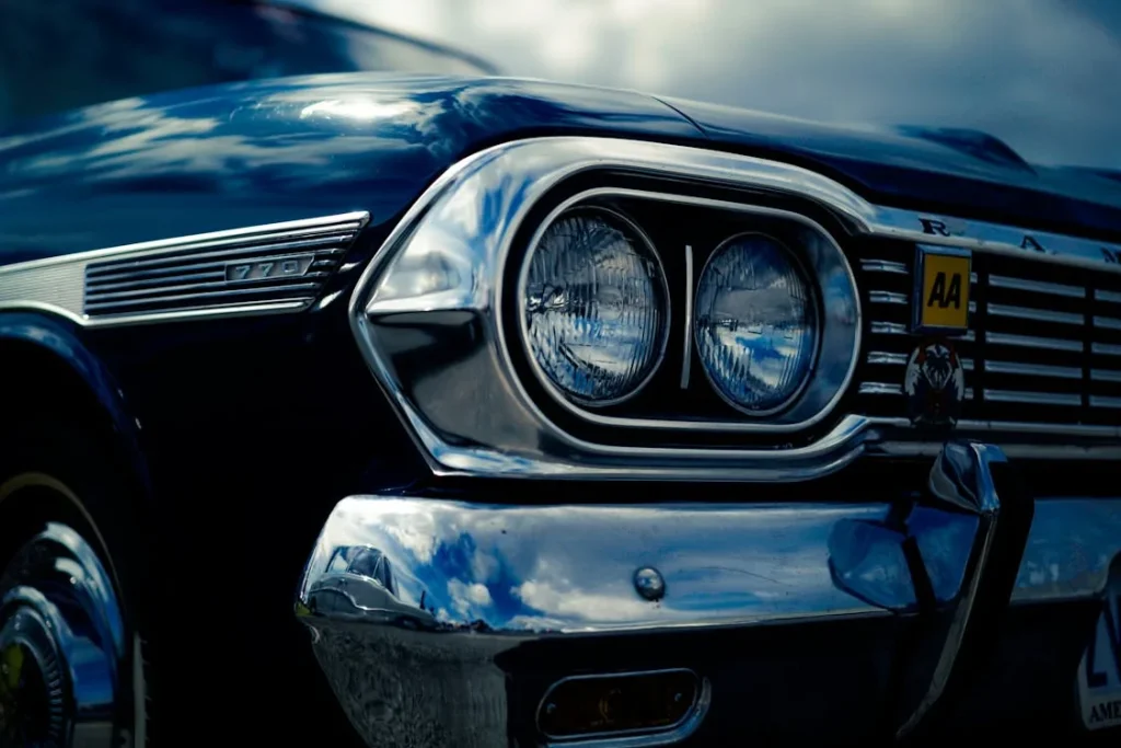 Close-up of a classic 1960s Rambler American car highlighting chrome grille and headlight details