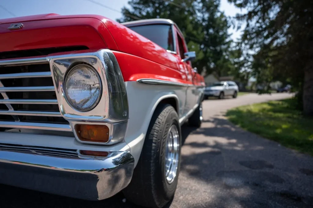 Classic red and white vintage truck on a suburban street