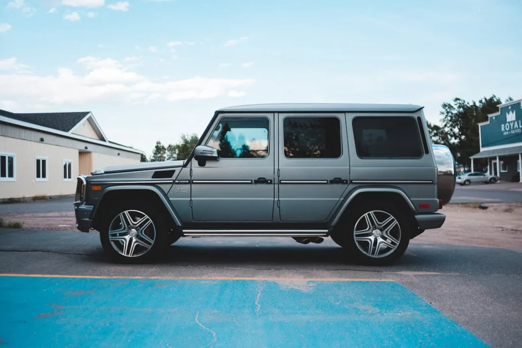 SUV parked on a residential road under a clear blue sky