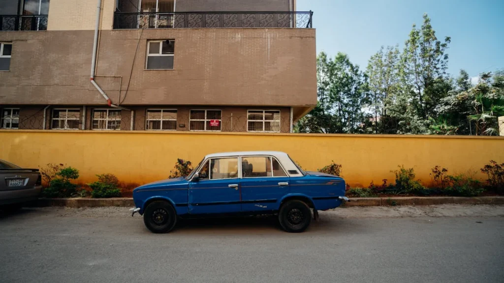 Photo of a blue sedan on a street