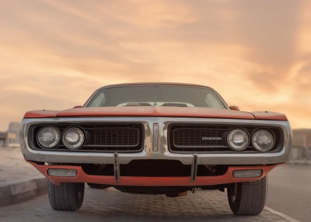 Photo of a classic Dodge muscle car at sunset