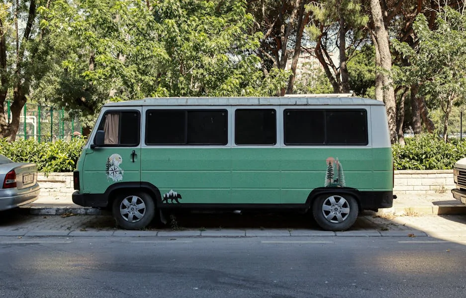 Retro camper van parked in green urban setting