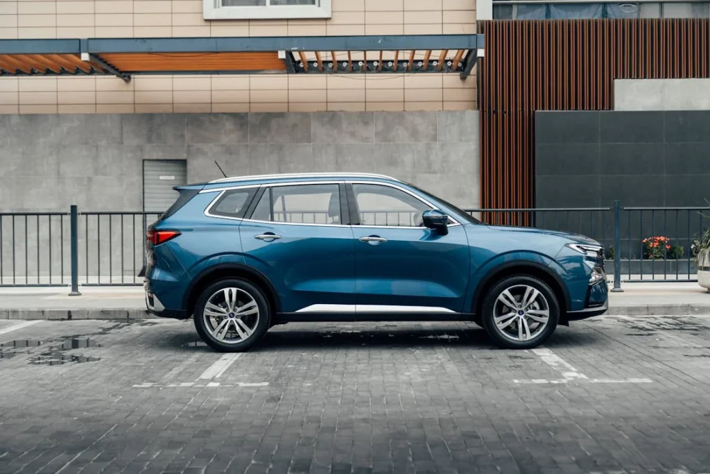 Sleek blue SUV parked in an urban setting in Erbil, Iraq