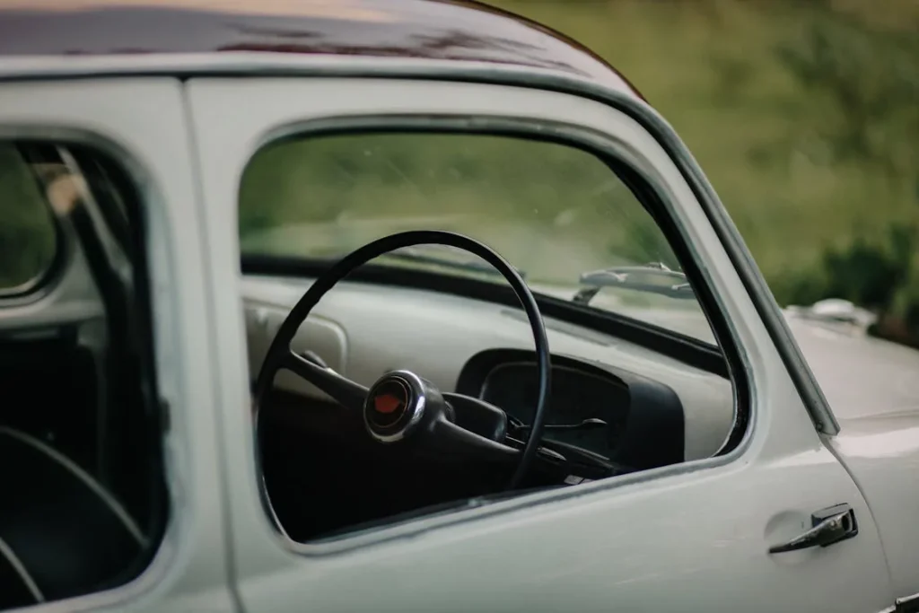 Close-up of a vintage car steering wheel