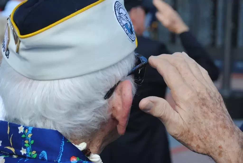 Veteran Pearl Harbor survivor saluting