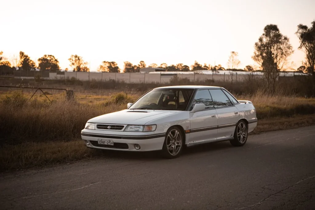 White car parked on the side of the street