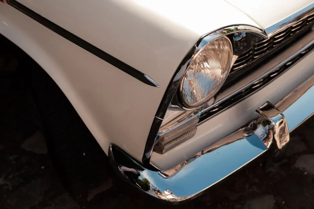 White classic car with round headlight