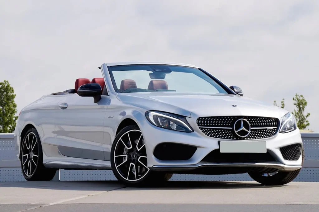 White Mercedes-Benz car parked on the street