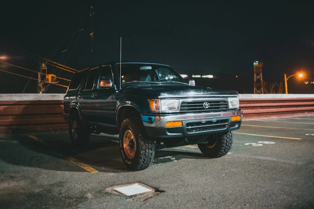 Car parked in a parking lot at night