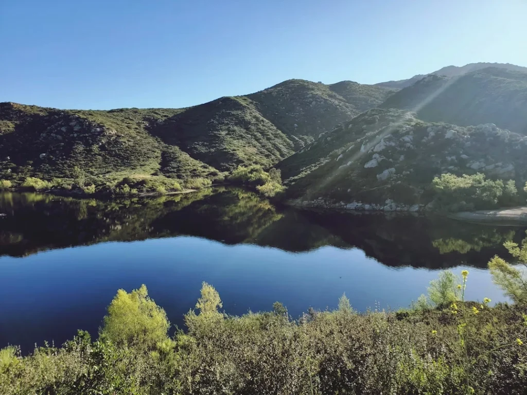 Lake surrounded by mountains and trees in Poway, California