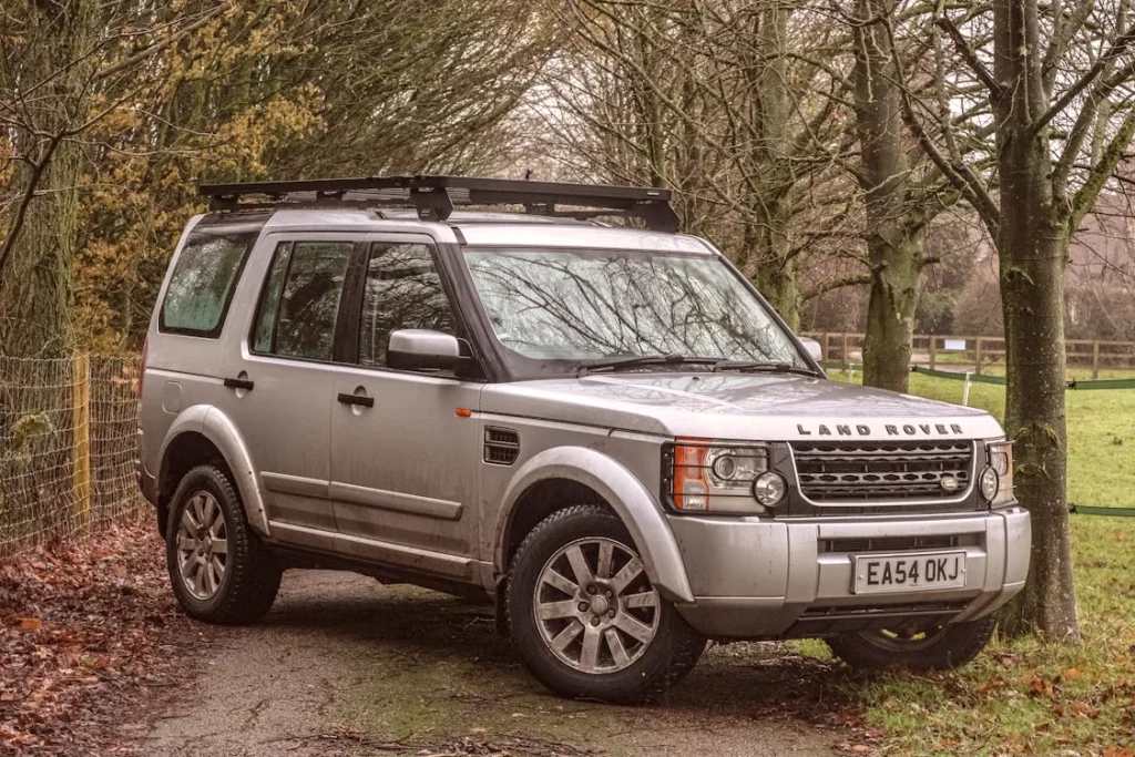 A Land Rover parked on a dirt road
