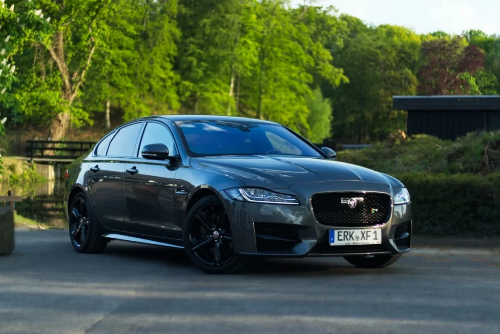 Black Audi coupe parked on a road