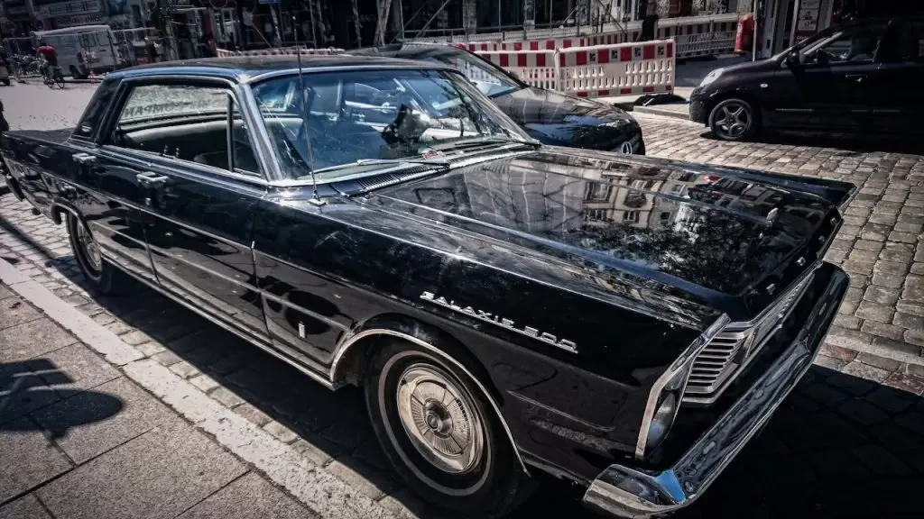 Black sedan on road
