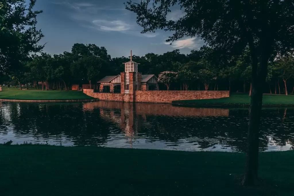 Brown concrete building near water in Irving, Texas