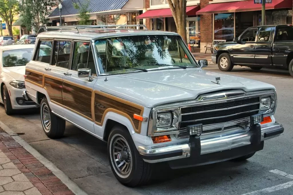 Classic Jeep Wagoneer parked on an urban street