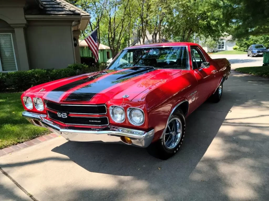 Red Chevrolet Chevelle parked on the road