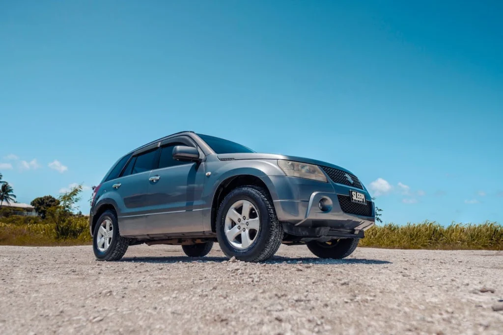 Suzuki Grand Vitara under a blue sky