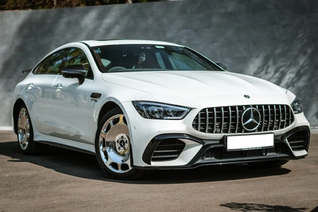 White Mercedes-Benz coupe on the road