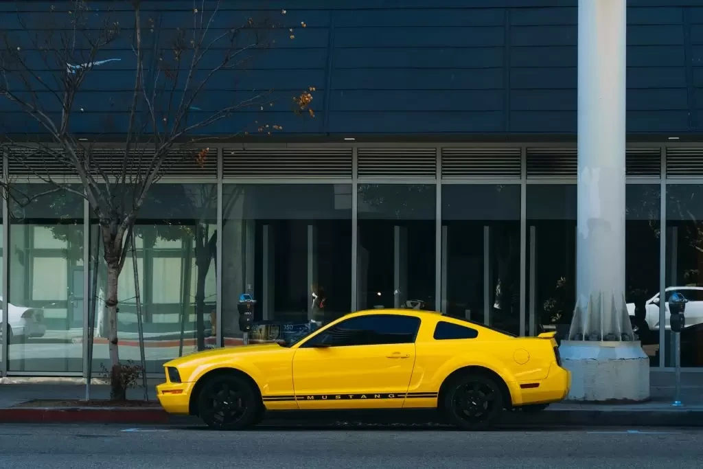 Yellow coupe parked outside a building in Torrance, California